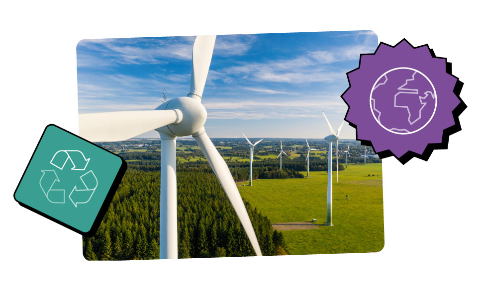 A birds eye shot of a wind farm with a sweeping rural landscape filled with fields and trees in the background.