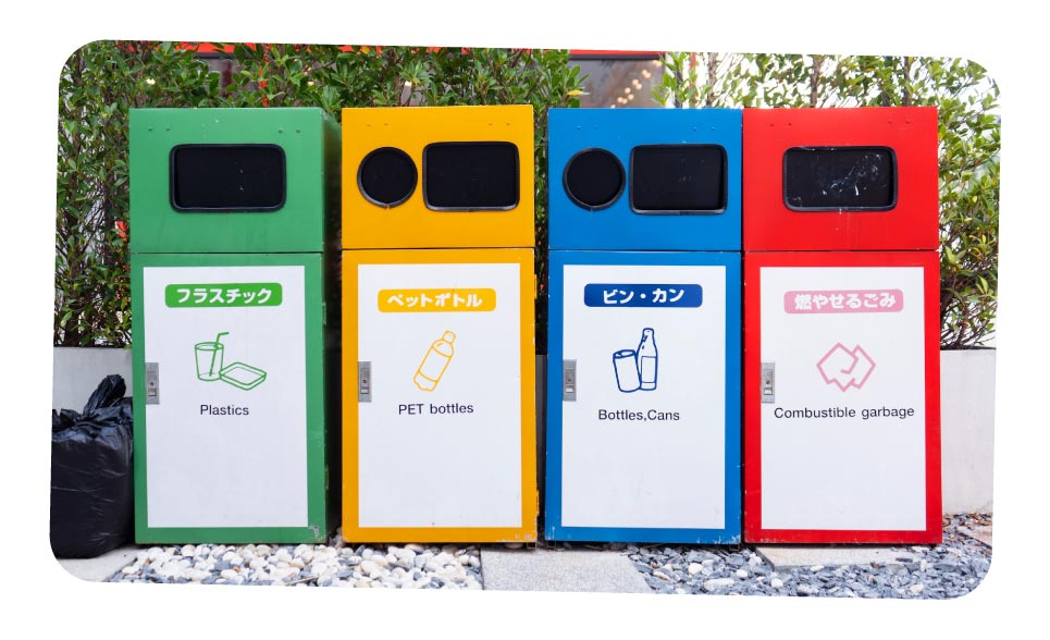 A row of colourful recycling bins for different kinds of waste in Japan.