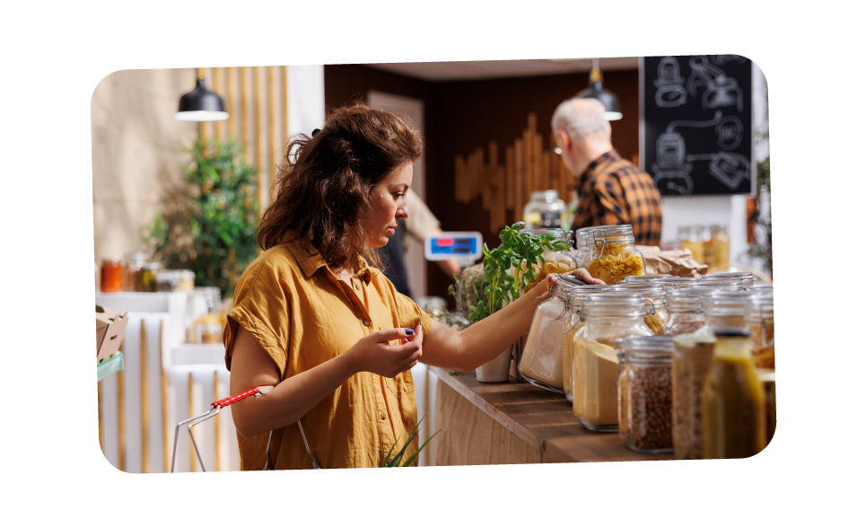 Woman looking at different refillable products in a shop