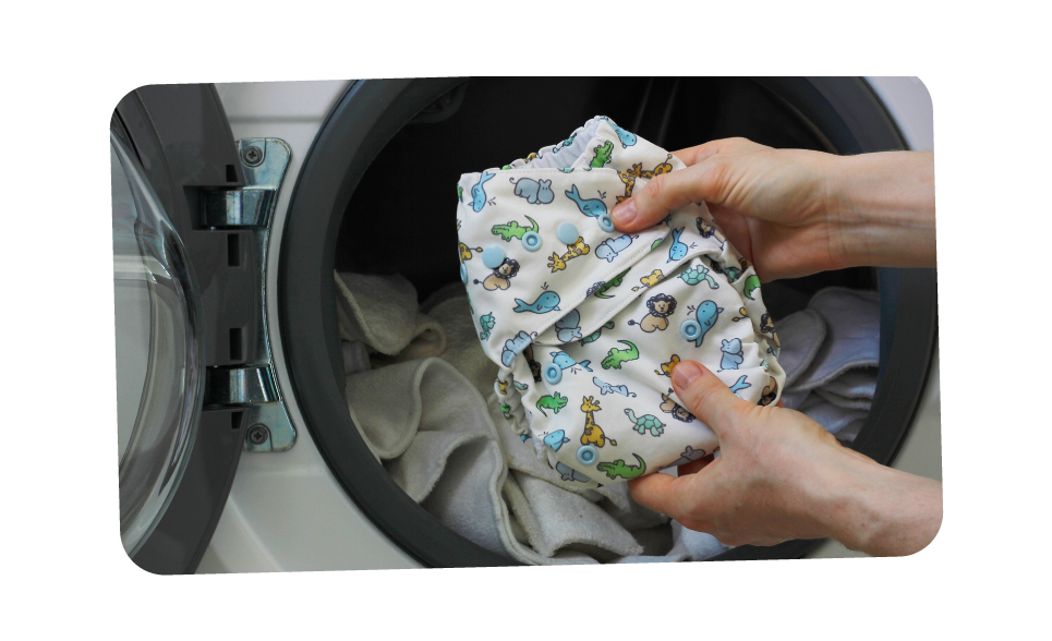 Person putting cloth nappy in wash bin