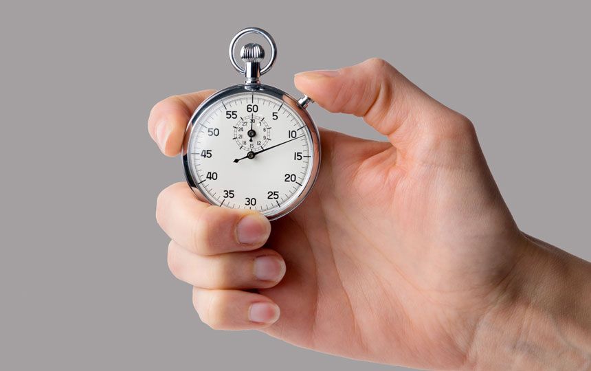 Someone is holding a silver-plated stopwatch which is pointing towards '10 seconds'.
