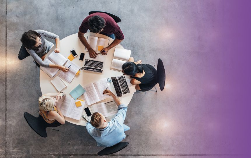 Three designed reports laid flat on a grey surface: Is Scotland/Britain/Wales Fairer?