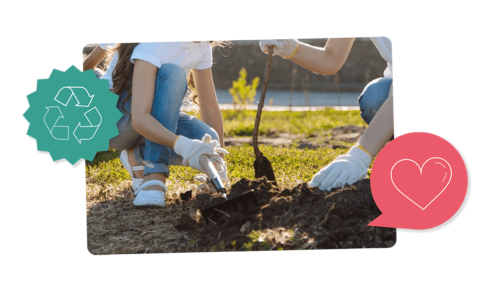 Two people planting a tree.