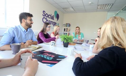 Image of team at board room table