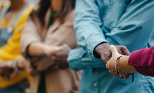 Group of people holding hands