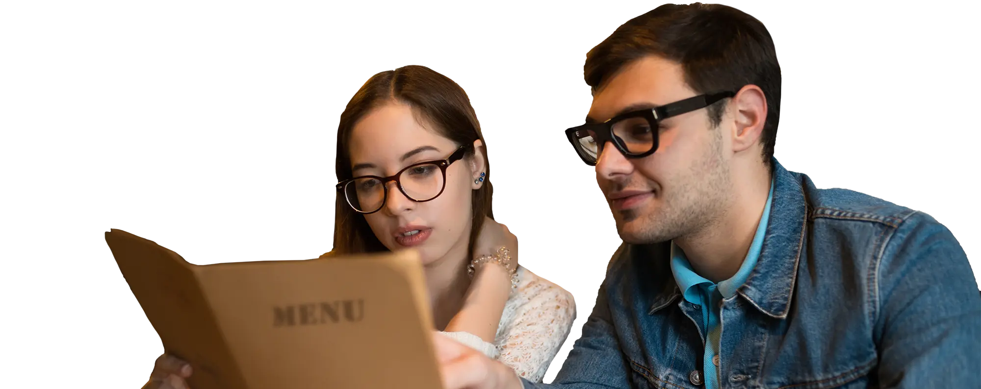 A couple choosing from a menu at a cafe.