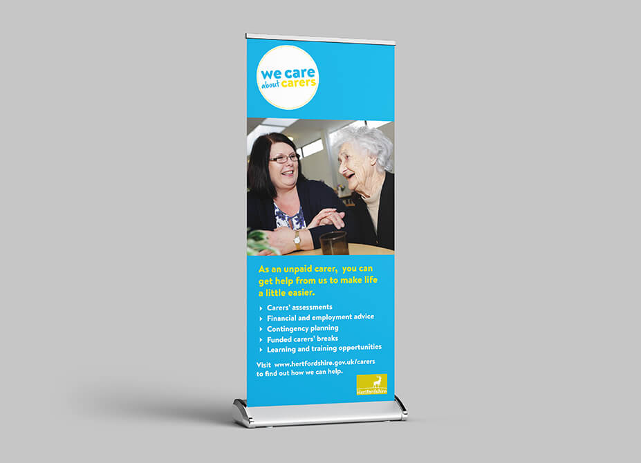 A pop-up banner featuring an elderly woman smiling and laughing with her caregiver.