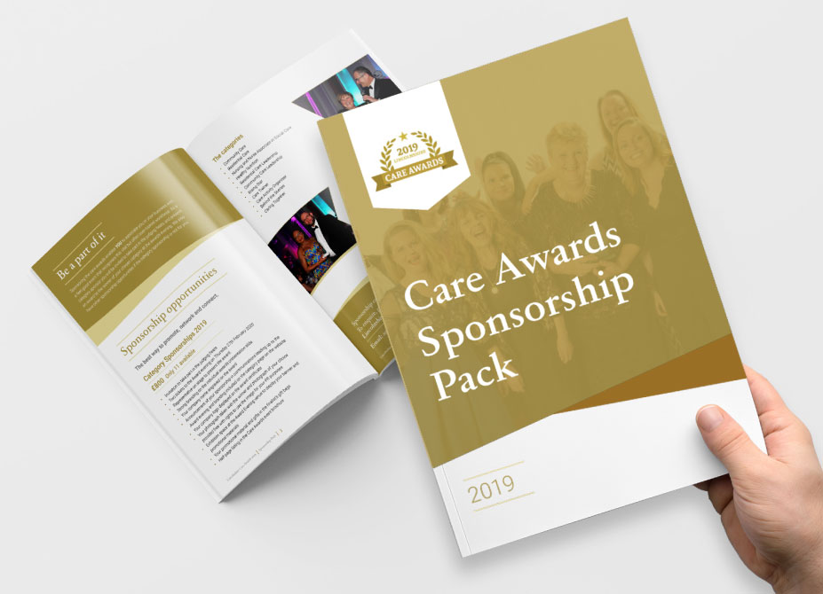 A hand holding a Lincolnshire Care Awards programme above a second open programme.