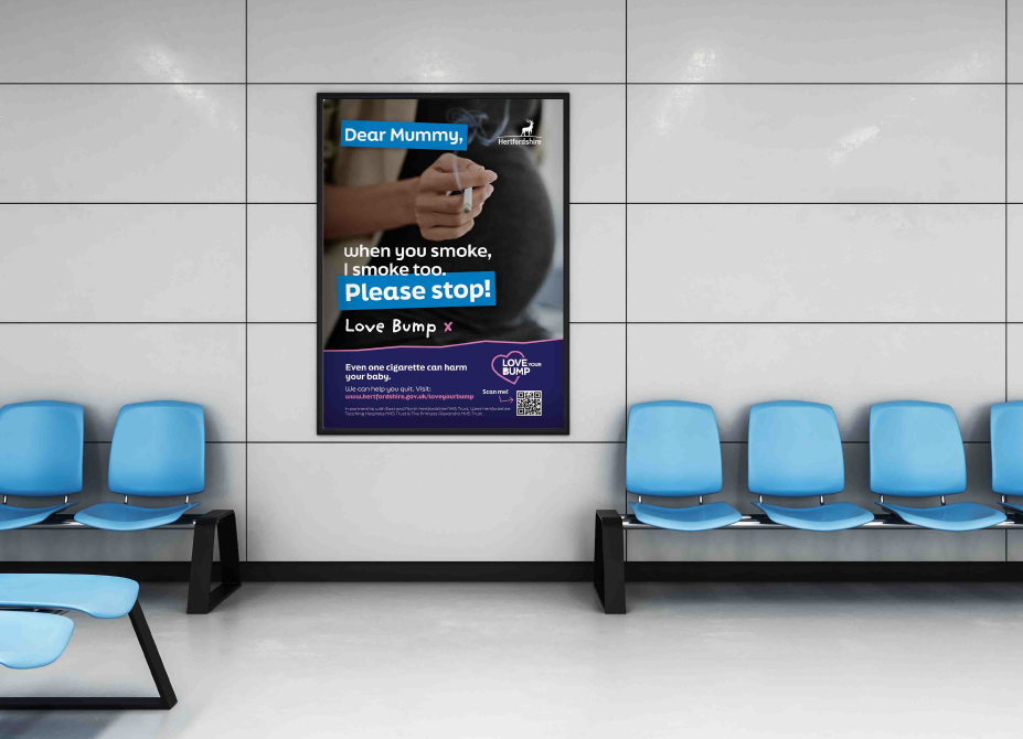 A campaign poster displayed on the wall in a waiting area.