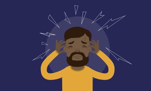 A stressed illustrated man rubbing the sides of his head.