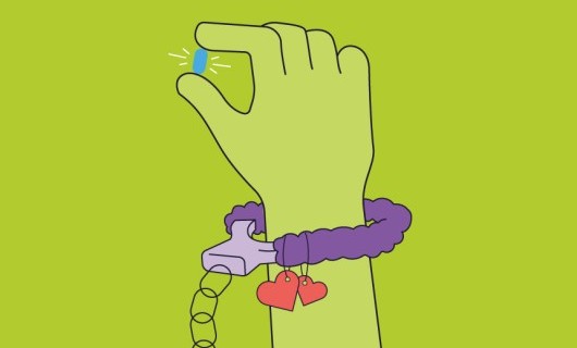 An illustration of a hand with fluffy handcuffs around the wrist holding a PrEP pill.